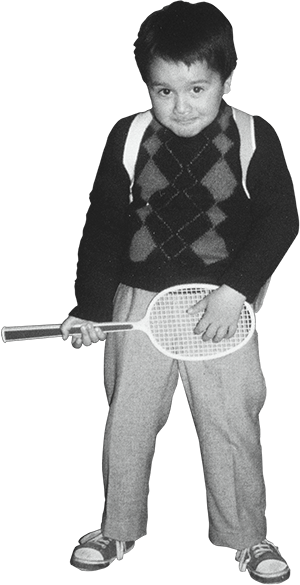 Pedro Rodrigues as a 5-year-old, holding a tennis racket like a guitar — 1987